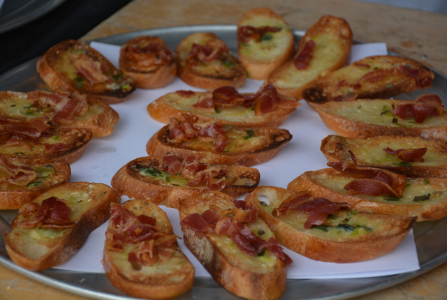 Crostini of vine charred scallion butter with oven crisped pancetta.