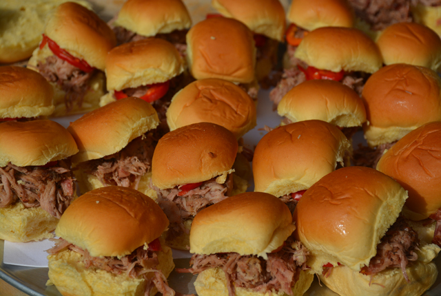 Vine smoked pork shoulder with pickled peppers on potato buns.