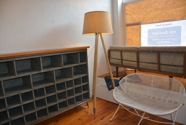 The industrial shelf unit and floor lamp were repurposed by Rory Klinge, the bench and sofa are original pieces (Credit: Monique Singh-Roy)