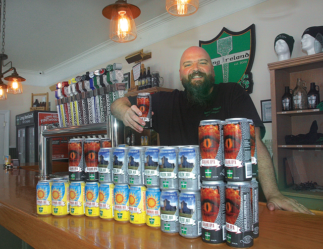 Dan Burke shows off Long Ireland's new cans. (Credit: Barbaraellen Koch)