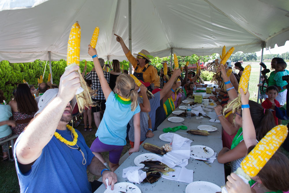 Farmer Fred prepares contestants for the corn eating contest. (Credit: Katharine Schroeder)