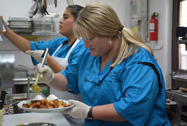 Chef Kristi Macdonald in the kitchen at Bay Breeze Inn (Credit: Monique Singh-Roy)