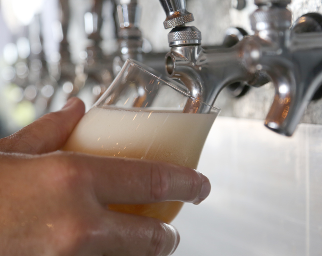 A beer is poured from a tap at Greenport Harbor Brewing Co.'s tasting room in Peconic. (Credit: Grant Parpan)