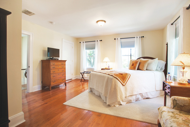 The new Wickham-Prince Bed & Breakfast features two rooms on Youngs Avenue in Southold. To the right: The Wickham, the larger of the two guest rooms. The smaller room is known as The Prince. Bottom right: Owner and innkeeper Susan Looze. (Credit: Katharine Schroeder)