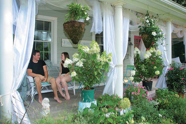 Connor Guditus and his sister Chelsea on the porch of their Main Road Mattituck home. (Credit: Barbaraellen Koch)