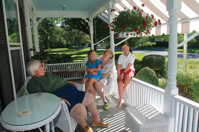 Doug and Karin Constant relaxing on their porch with grandchildren Reilly, 6, and Logan Constant, 9, visiting from Hartsdale NY. (Credit: Barbaraellen Koch)