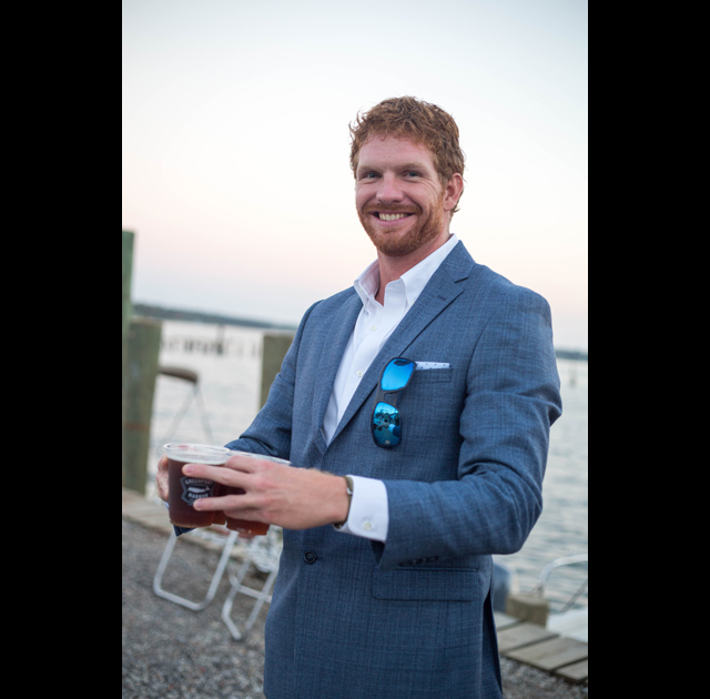 Colin Hickey enjoys some of Greenport breweries seasonal beers.