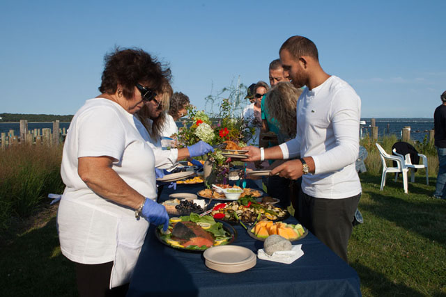 Diane Zory, left, works the buffet table.