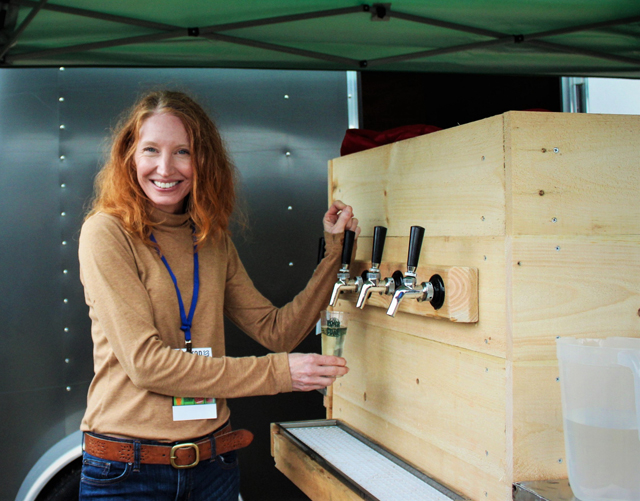 Lisa pours Woodside Orchards hard cider.