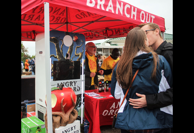 Katie Ciccarelli and Joe Bell (both of Farmingdale) pose for the Angry Orchard photo both with a kiss.