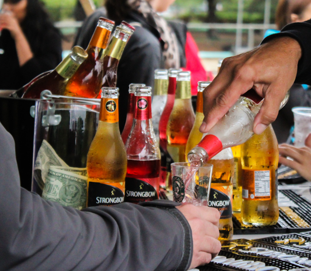 Pouring assorted samples of Strongbow.