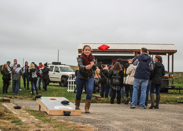 Kaitlyn Robar of Holbrook tosses a beanbag,