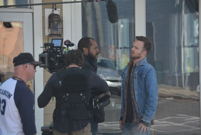 Rockmond Dunbar (l.) and Aaron Paul (r.) shoot a scene for "The Path" on Front Street today in Greenport (Credit: Monique Singh-Roy)