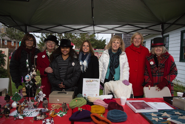 Nichol Morizzo, Geri Lacy, Sophea Angielczyk, Lorrie Saporita, Heidi Fleming And Jan Day of Southold sell raffle tickets and hand made crafts.