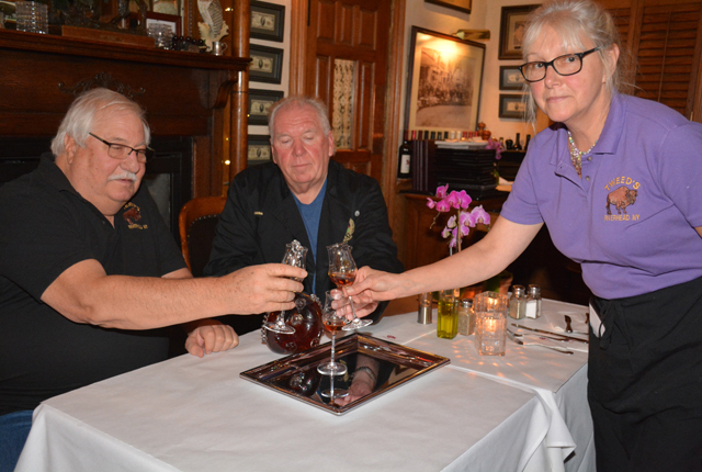 Tweed's owner Ed Tuccio drinks a $300 toast with Thanksgiving chef Duane Lewin and regular waitress Susie Ribeiro. (Credit: Monique Singh-Roy)